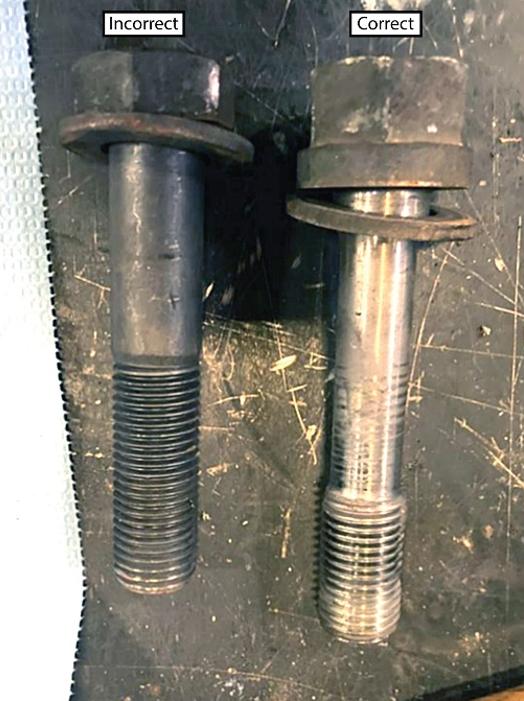 Figure 5. Incorrect gearcase mounting bolt installed on traction motor #4 of locomotive KCS 4767 and the correct mounting bolt for comparison