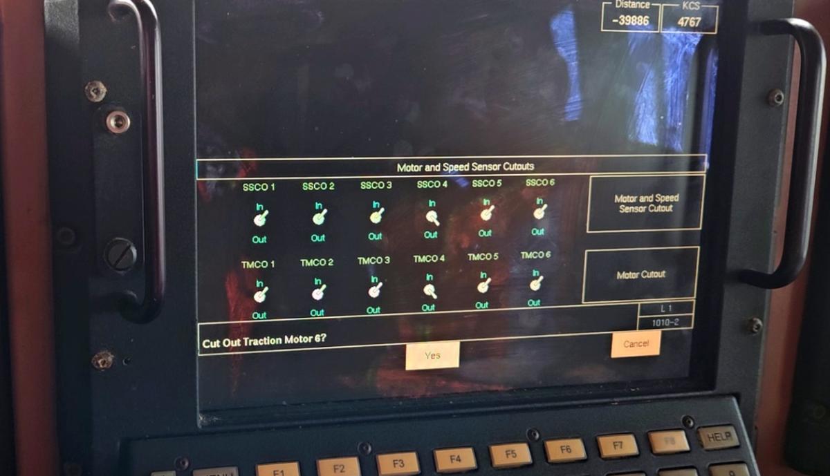 Figure 8. Motor and Speed Sensor Cutouts screen on a locomotive in the ES44AC series, showing a prompt to confirm cutting out a traction motor 