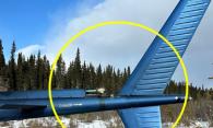 Figure 4. Marques sur la poutre de queue (mot « DANGER » et flèche) de l’hélicoptère à l’étude, et rayon approximatif de l’arc du rotor de queue (Source : Heli Explore Inc., avec annotations du BST)